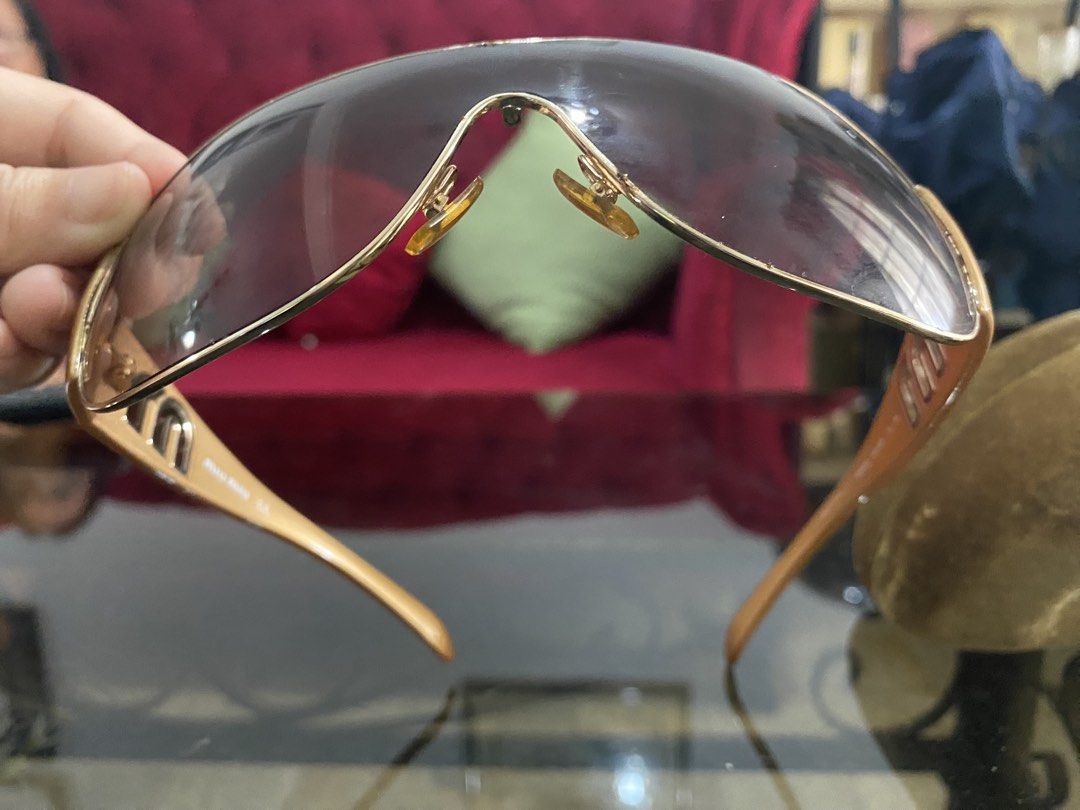 Authentic Miu Miu Sunglasses with Case (Category: Sunglasses & Eyewear) located in Las Pinas. Submitted by stylishchique (Listing ID 1451323227, Image 3). Description: - Authentic Miu Miu sunglasses - Elegant gold frame - Stylish brown lenses - Comes with original Miu Miu case - Ideal for sunny weather.