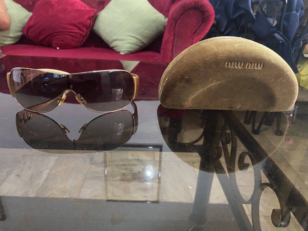 Authentic Miu Miu Sunglasses with Case (Category: Sunglasses & Eyewear) located in Las Pinas. Submitted by stylishchique (Listing ID 1451323227, Image 2). Description: - Authentic Miu Miu sunglasses - Elegant gold frame - Stylish brown lenses - Comes with original Miu Miu case - Ideal for sunny weather.