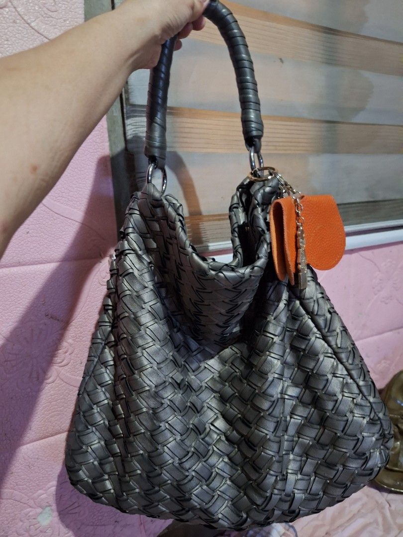 Miu Miu Woven Leather Hobo Bag (Category: Luxury Bags & Wallets) located in Quezon City. Submitted by cloudymay (Listing ID 1451154066, Image 3). Description: - Grey woven leather hobo bag - Features Miu Miu logo on metal plate - Braided leather handles - Silver hardware - Dark satin interior lining - Stylish and unique accessory -normal signs of use. has minor flaw that can be glued unnoticed. - Has certificate of authenticity from the prelove s