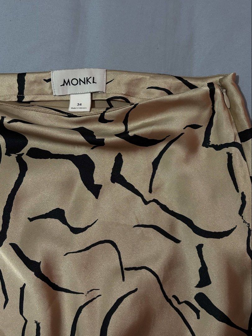 MONKI Satin Midi Skirt (Category: Skirts) located in Pasay City. Submitted by mochasminimart (Listing ID 1451177631, Image 1). Description: -Side zip closure -Orig price: 2k -Swipe to see small flaw on the skirt. Barely noticeable .