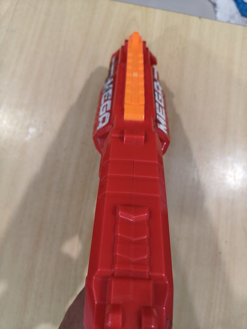 Nerf N-Strike Mega CycloneShock Blaster (Category: Toys & Games) located in Puchong. Submitted by gttrading (Listing ID 1451247857, Image 3). Description: - Red and grey Nerf Mega CycloneShock blaster - Fires Mega Whistler darts - Features a rotating barrel - Perfect for outdoor fun - Shows minor scuffs from normal play, but still works perfectly!.