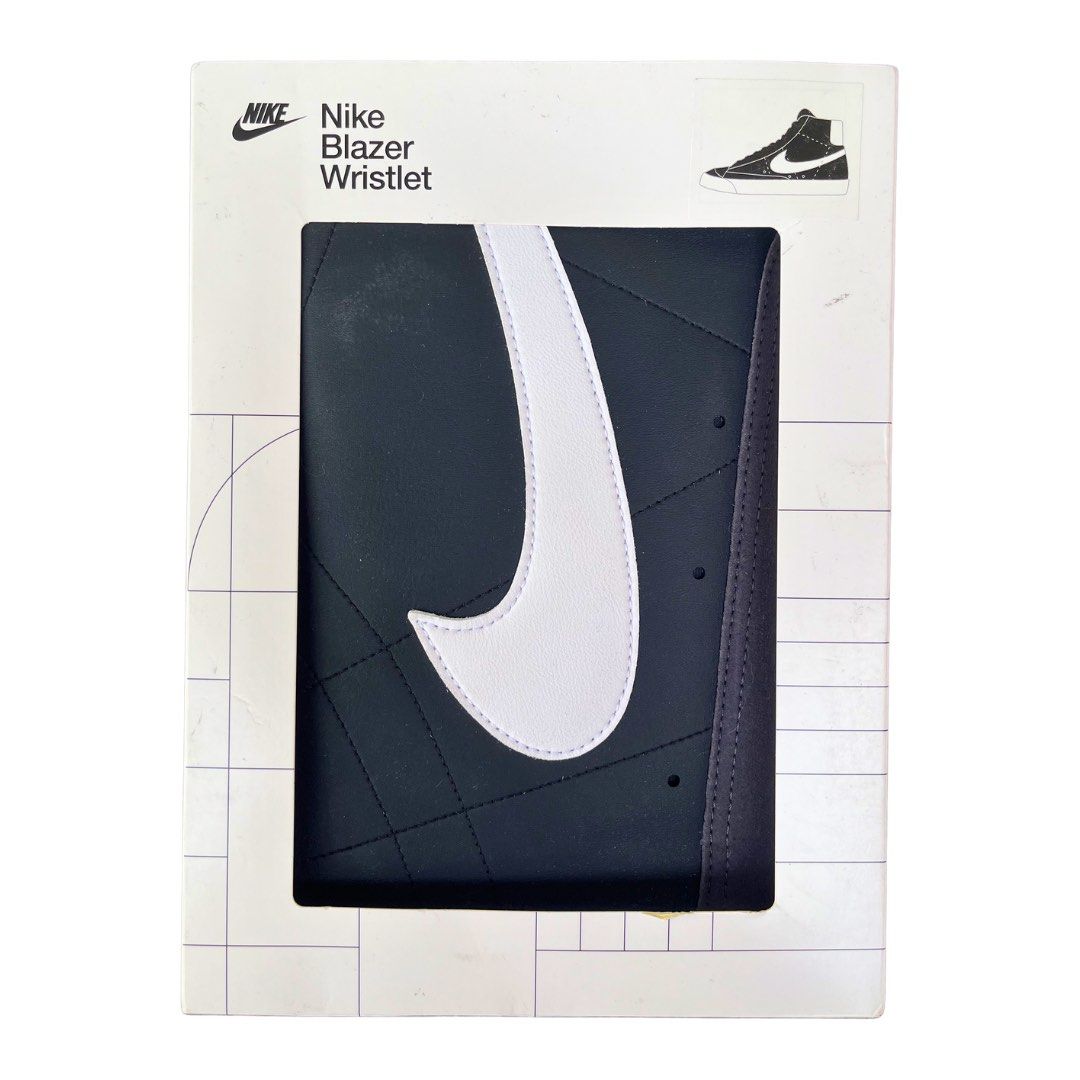 Nike Blazer Wristlet Pouch (Category: Purses & Pouches) located in Angeles City. Submitted by 4sureph (Listing ID 1451203706, Image 1). Description: - Nike Blazer Wristlet - Inspired by the Nike shoe - Holds phones and small essentials - Zippered pocket with interior slot for cards and cash - Features iconic Nike Swoosh design - Includes a convenient wrist strap - Color: Black with White Swoosh.