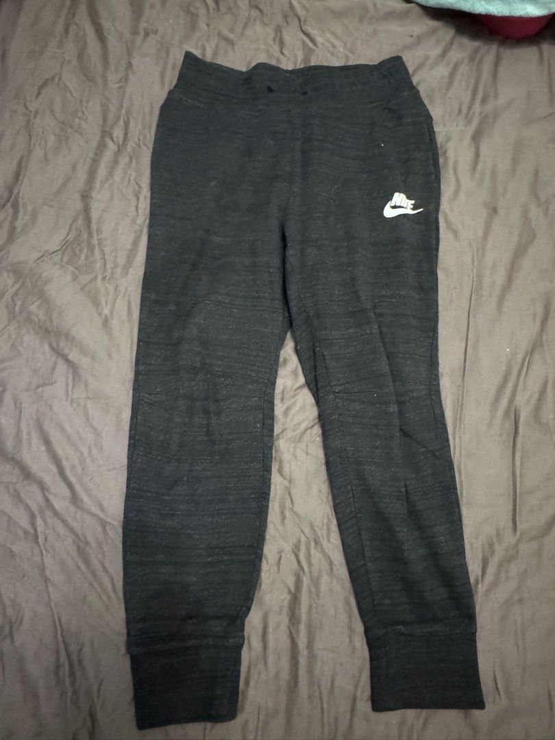 Nike Tech Fleece Sweatpants (Category: Joggers) located in Manila. Submitted by safeshark.4feb32 (Listing ID 1451321955, Image 1). Description: - Classic fit black Nike sweatpants - Comfortable for everyday wear - Iconic Nike swoosh logo - Elastic waistband with adjustable drawstring - Ribbed cuffs at the ankles - Ideal for lounging or workouts -can fit xs-medium women.
