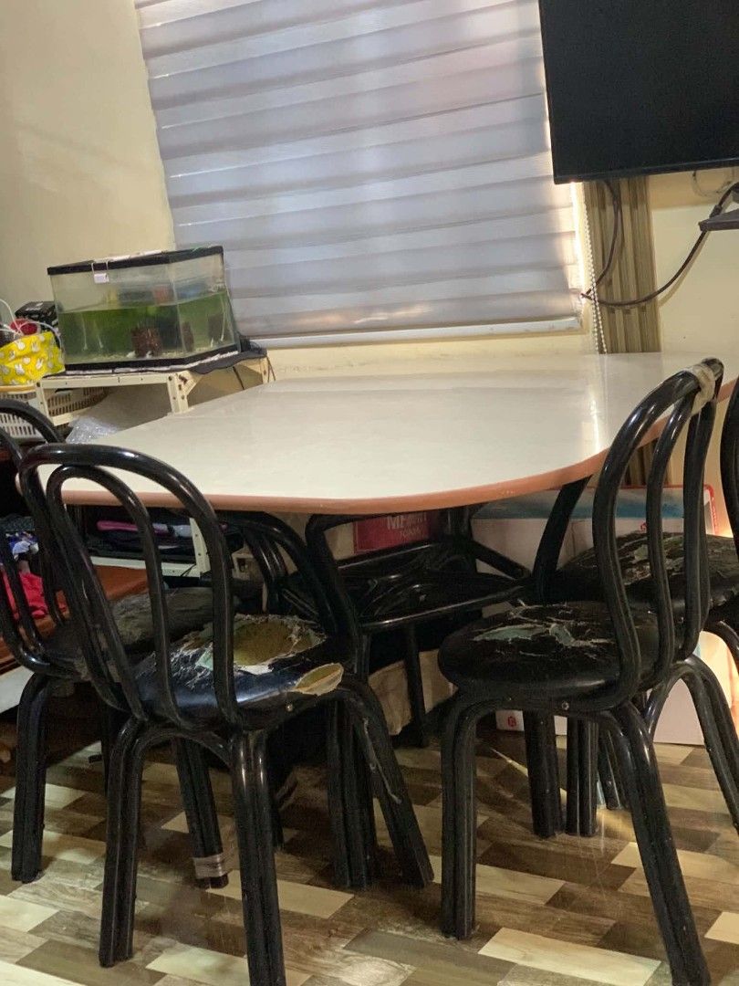 Oval Dining Table with 4 Chairs (Category: Tables & Sets) located in General Trias. Submitted by seisuke.kanou (Listing ID 1451138306, Image 1). Description: - Oval dining table with a white tiled top - Includes 4 black metal chairs - Table is sturdy and functional - Chairs feature a curved backrest - Sold as a complete set.