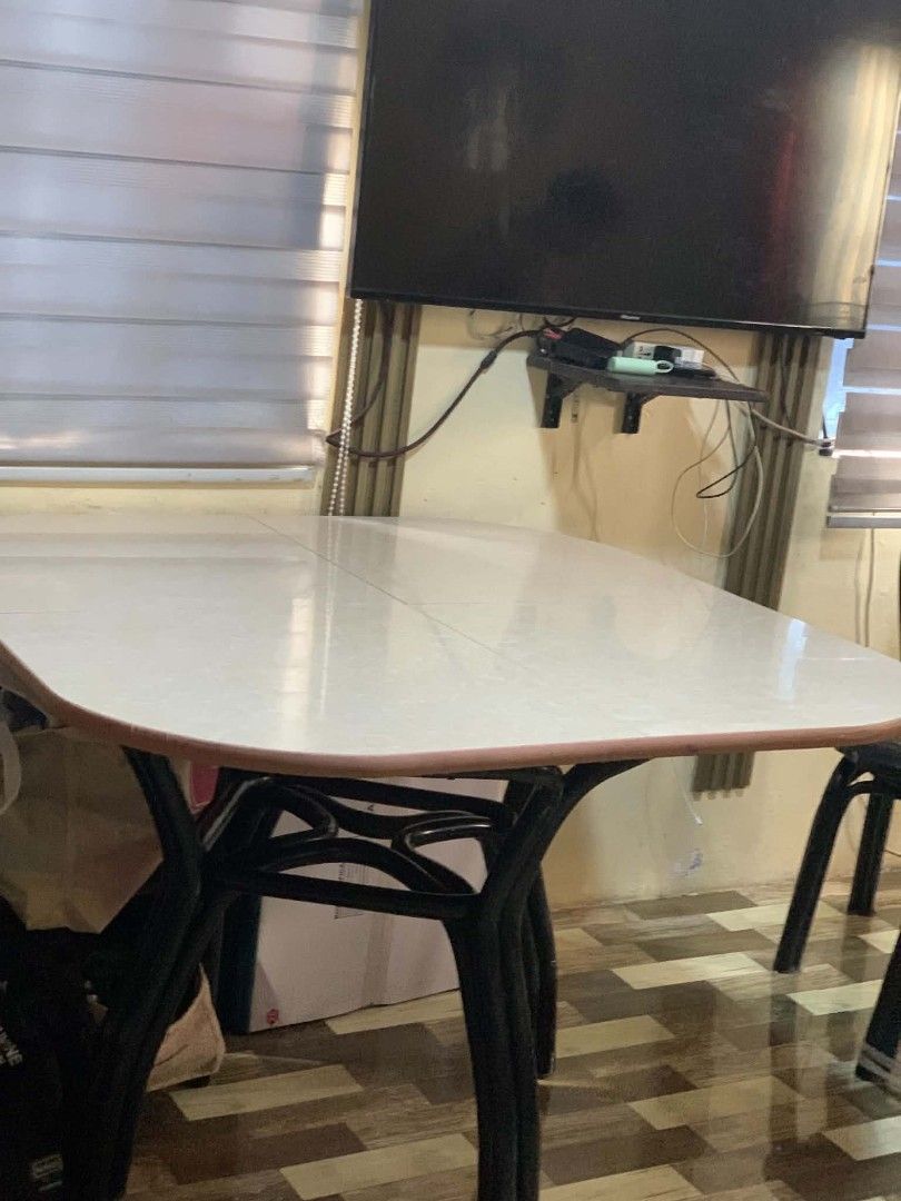 Oval Dining Table with 4 Chairs (Category: Tables & Sets) located in General Trias. Submitted by seisuke.kanou (Listing ID 1451138306, Image 2). Description: - Oval dining table with a white tiled top - Includes 4 black metal chairs - Table is sturdy and functional - Chairs feature a curved backrest - Sold as a complete set.