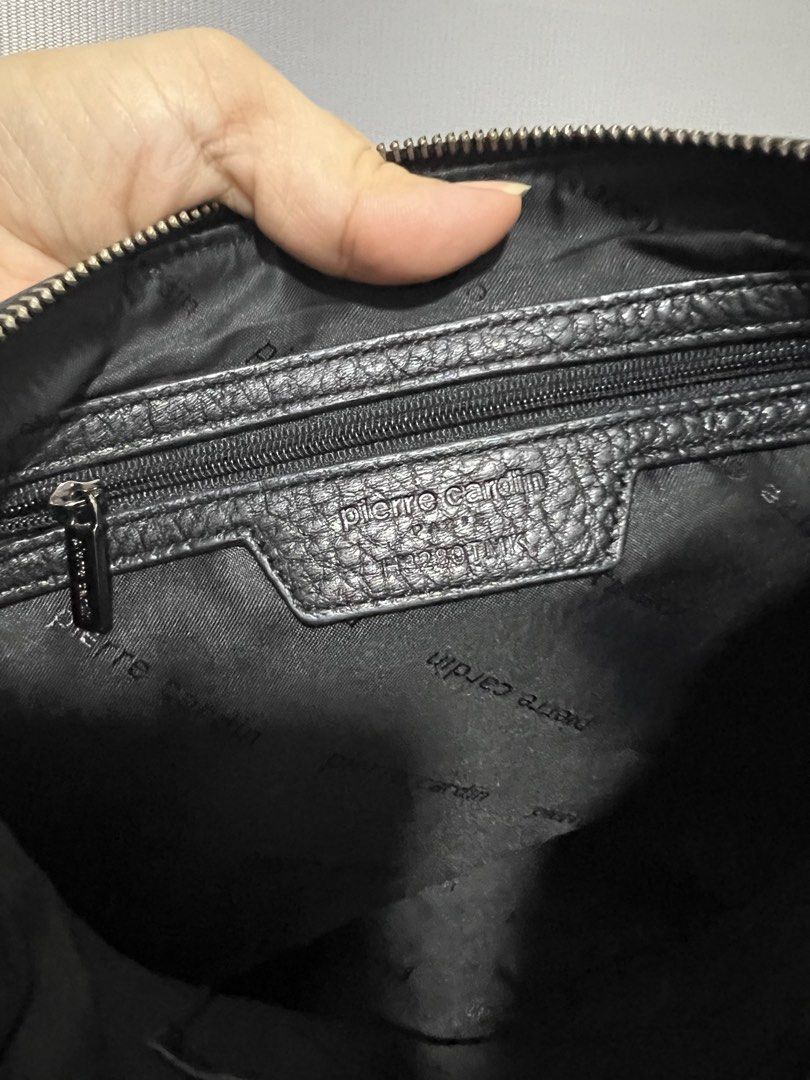 Pierre Cardin Black Leather Shoulder Bag (Category: Shoulder Bags) located in Las Pinas. Submitted by maple0305 (Listing ID 1451258038, Image 3). Description: - Authentic Pierre Cardin black leather shoulder bag - Textured leather with embossed logo detail - Secure zip closure - Silver-tone hardware - Interior zip pocket and branded lining - Ideal for everyday wear.
