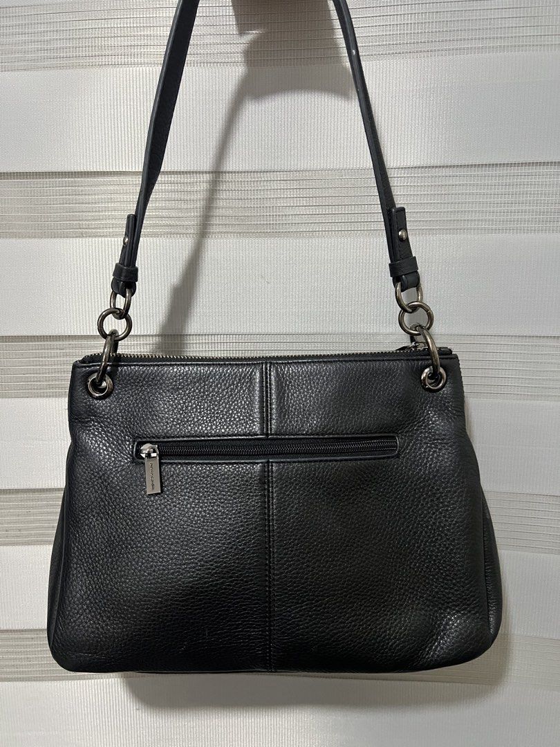 Pierre Cardin Black Leather Shoulder Bag (Category: Shoulder Bags) located in Las Pinas. Submitted by maple0305 (Listing ID 1451258038, Image 2). Description: - Authentic Pierre Cardin black leather shoulder bag - Textured leather with embossed logo detail - Secure zip closure - Silver-tone hardware - Interior zip pocket and branded lining - Ideal for everyday wear.