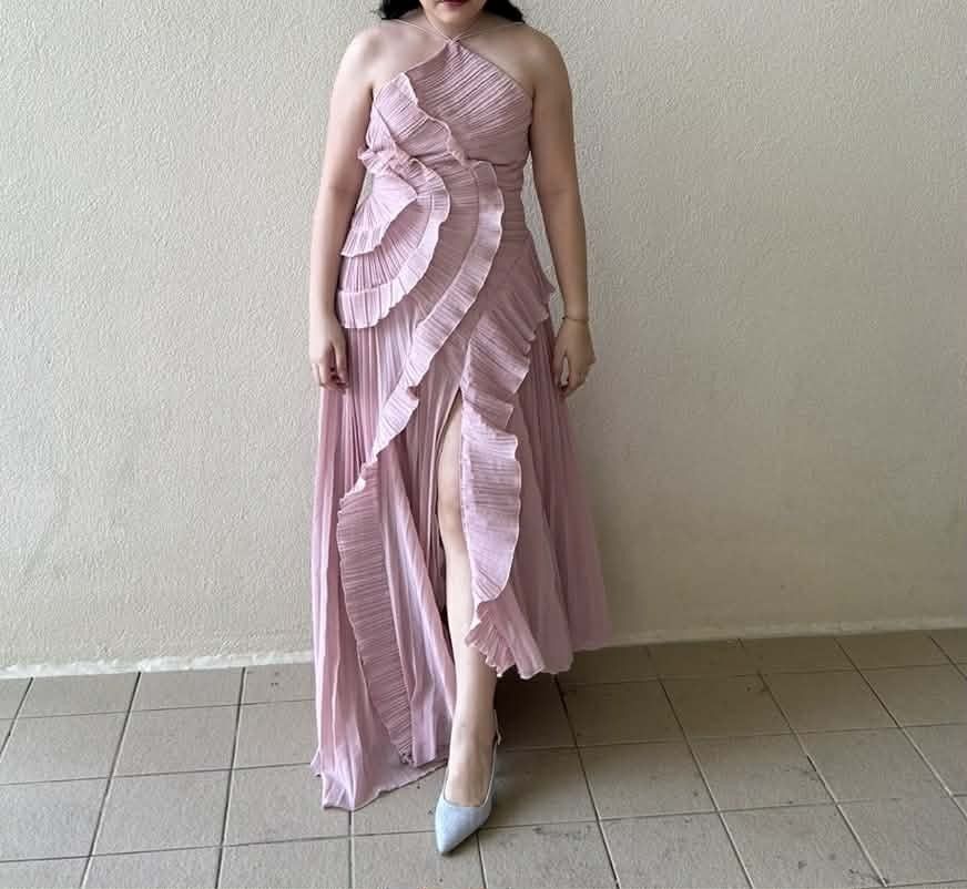 Pink Pleated Halter Neck Ruffle Dress (Category: Dresses) located in Cebu City. Submitted by ibyang_blgn (Listing ID 1451246434, Image 3). Description: - Beautiful pink pleated dress - Flattering halter neck with ruched bodice - Cascading ruffles down the front - Modern asymmetrical hemline - Ideal for special occasions or a night out - Comfortable and chic design.