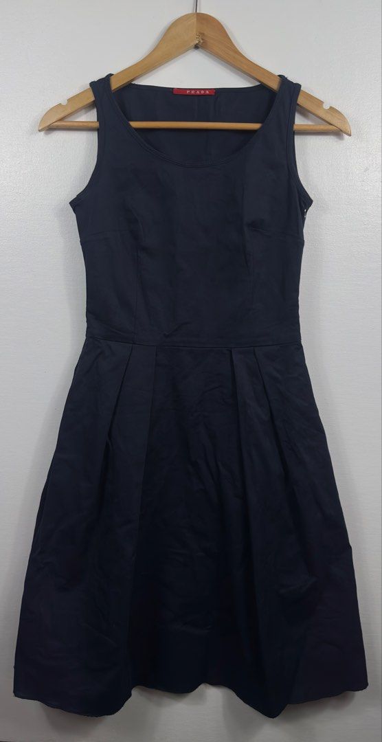 Prada Black Sleeveless Pleated Dress (Category: Dresses) located in Manila. Submitted by collect__ph (Listing ID 1451176874, Image 3). Description: - Classic black Prada dress - Sleeveless design - Flattering A-line skirt - Subtle pleating at the waist for volume - Versatile for dressing up or down - Zipper closure at the back - Made in Italy.