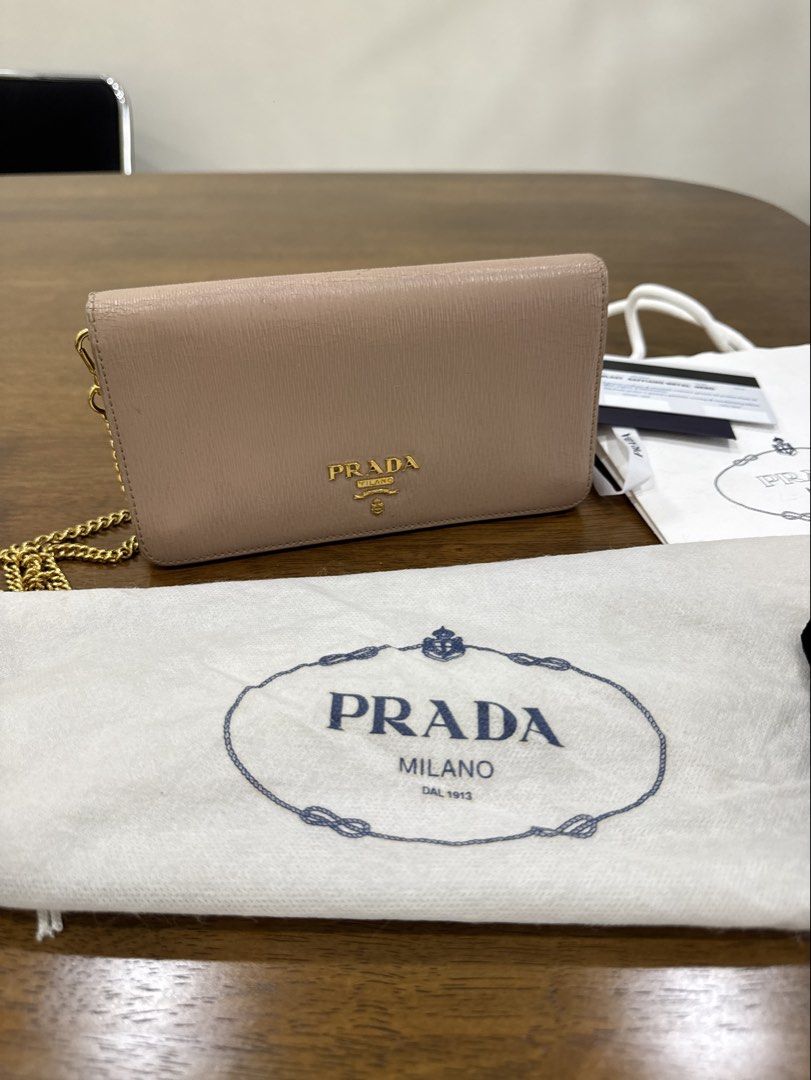 Prada Saffiano Metal Nero WOC (Category: Luxury Bags & Wallets) located in Bacolod City. Submitted by bagdropph (Listing ID 1451302696, Image 1). Description: - Authentic Prada Wallet on Chain (WOC) - Saffiano leather in Nero - Comes with original packaging - paper bag, dust bag, ribbons, card (except box) - All hardware still crisp gold - Bought also here in carousel - With rippling inside flap due to long storage; not obvious when bag is closed