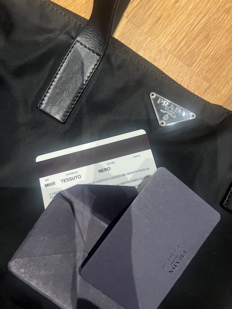 Prada Tessuto Nylon Tote Bag Black (Category: Luxury Bags & Wallets) located in Quezon City. Submitted by lovedbygrace (Listing ID 1451278699, Image 3). Description: - Authentic Prada tote bag - Durable black nylon material - Comfortable leather handles - Interior zip pocket for secure storage - Signature Prada logo lining - Includes authenticity card - Comes with original dust bag - Ideal everyday bag for your essentials.