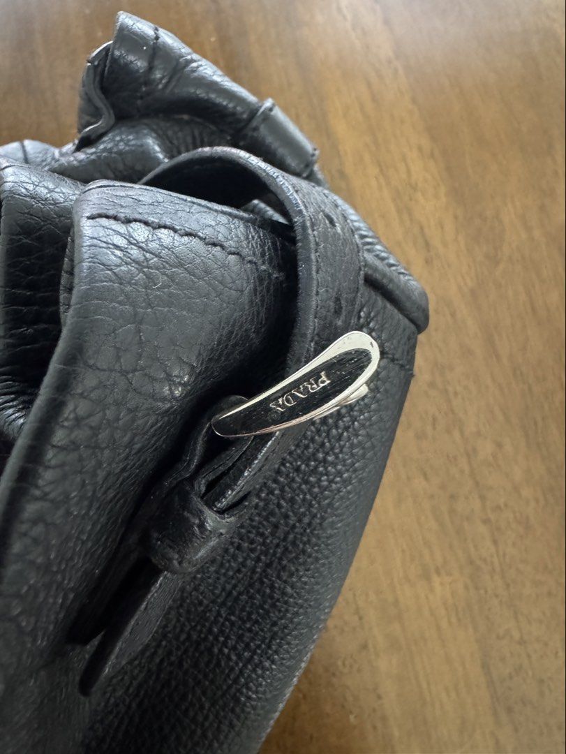 Prada Vitello Daino Side Pocket Bag (Category: Luxury Bags & Wallets) located in Bacolod City. Submitted by bagdropph (Listing ID 1451301427, Image 3). Description: - Authentic Prada Vitello Daino Side Pocket Tote Bag - With Entrupy certificate of authenticity - Pebbled leather exterior - Silver hardware details - Interior zip pocket - Ideal for everyday and office use.