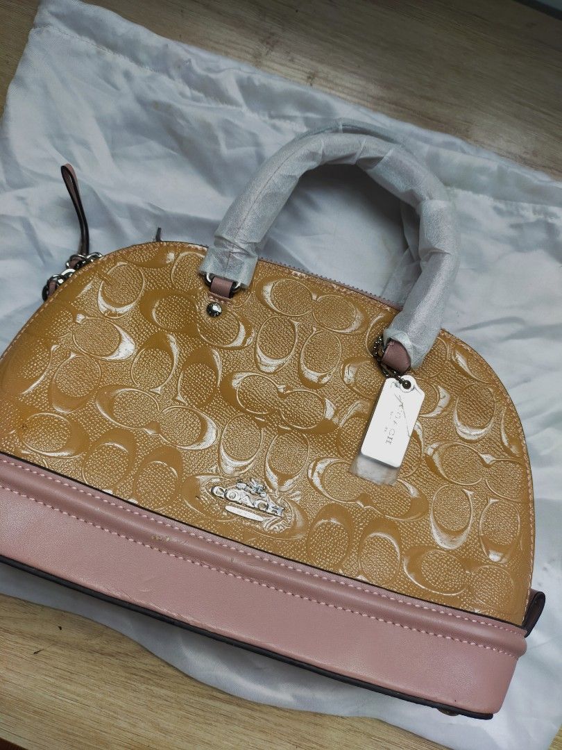 (READ DESCRIPTION!!) AUTHENTIC COACH PINK mini sierra satchel bag (Category: Luxury Bags & Wallets) located in Las Pinas. Submitted by jendeukie.declutters (Listing ID 1451217716, Image 2). Description: — FIXED PRICE. Non nego. — authentic coach sling/hand bag. — color: pink with glitters — condition is lightly used due to its defects but it has never been used. Stored in a box only, but already fragile due to its age and vintage condition. — com