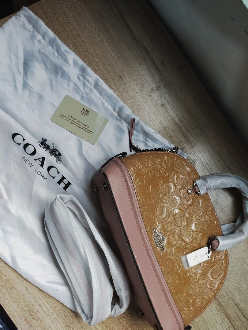 (READ DESCRIPTION!!) AUTHENTIC COACH PINK mini sierra satchel bag (Category: Luxury Bags & Wallets) located in Las Pinas. Submitted by jendeukie.declutters (Listing ID 1451217716, Image 1). Description: — FIXED PRICE. Non nego. — authentic coach sling/hand bag. — color: pink with glitters — condition is lightly used due to its defects but it has never been used. Stored in a box only, but already fragile due to its age and vintage condition. — com