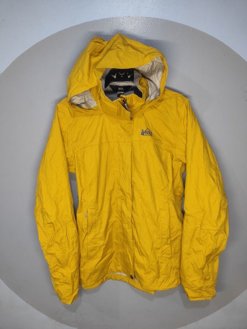 REI Co-op Yellow Rain Jacket (Category: Coats, Jackets and Outerwear) located in Baguio. Submitted by real_dunn (Listing ID 1451228569, Image 1). Description: - REI Co-op yellow rain jacket - Small for men Medium for women - Lightweight and packable - Front zipper closure - Two front pockets - Ideal for outdoor adventures and everyday wear.