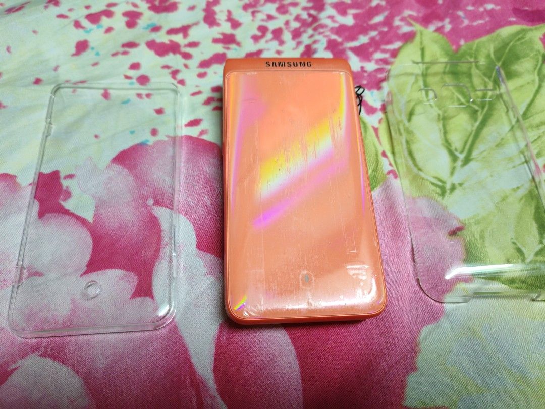 Samsung Galaxy Folder 2 Coral color (Category: Samsung) located in Makati City. Submitted by mybentables (Listing ID 1451277093, Image 1). Description: Bought in Korea Second hand Works well with PH sim With scratches at the back and sides but overall good condition Has no box, with micro usb charger provided by seller and the clear hard case Non negotiable. This is the last price..