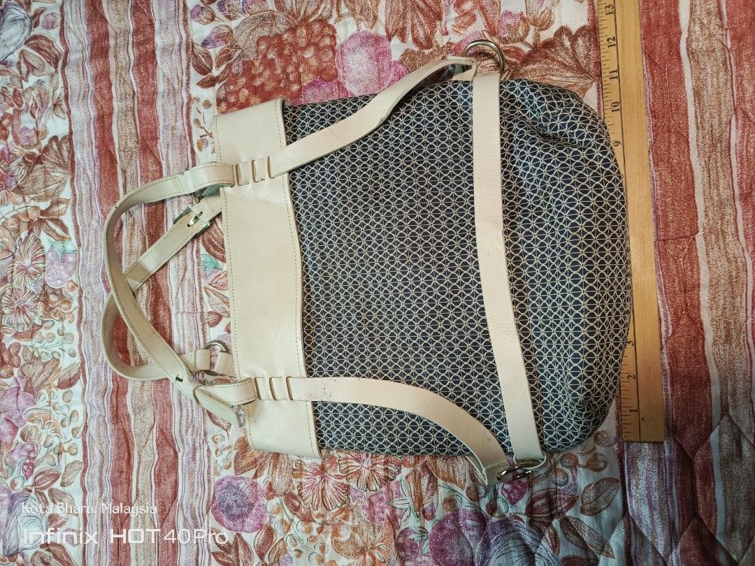 Solezia Backpack Bag (Category: Backpacks) located in Kuala Lumpur. Submitted by grandturtle_dd5ca3 (Listing ID 1451270164, Image 1). Description: - Solezia backpack with unique patterned fabric - Beige faux leather accents for a stylish touch - Adjustable straps for comfortable carrying - Interior includes multiple pockets and a zippered compartment - Ideal for everyday adventures and errands.