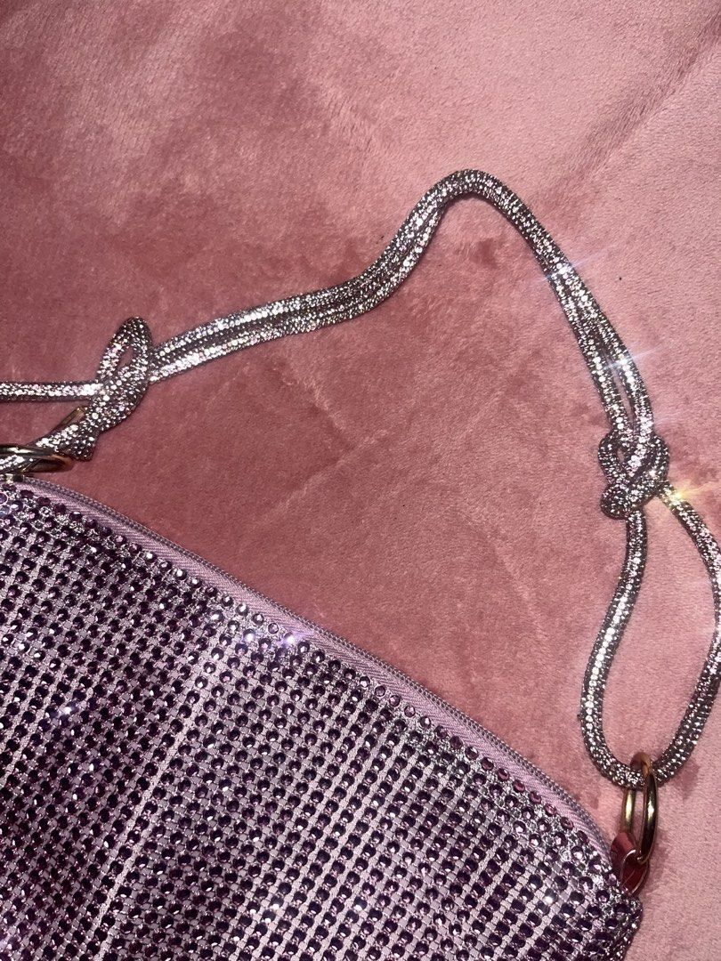 Sparkly Rhinestone Clutch Bag with Silver Chain Strap (Category: Clutches) located in Pasay City. Submitted by losient (Listing ID 1451163133, Image 2). Description: - Super cute sparkly clutch bag covered in rhinestones. - Detachable/tieable silver chain strap included. - Secure zipper closure. - Soft lilac fabric lining inside. - Ideal for nights out, parties, and special occasions. - Fits essentials: phone, keys, and cards..
