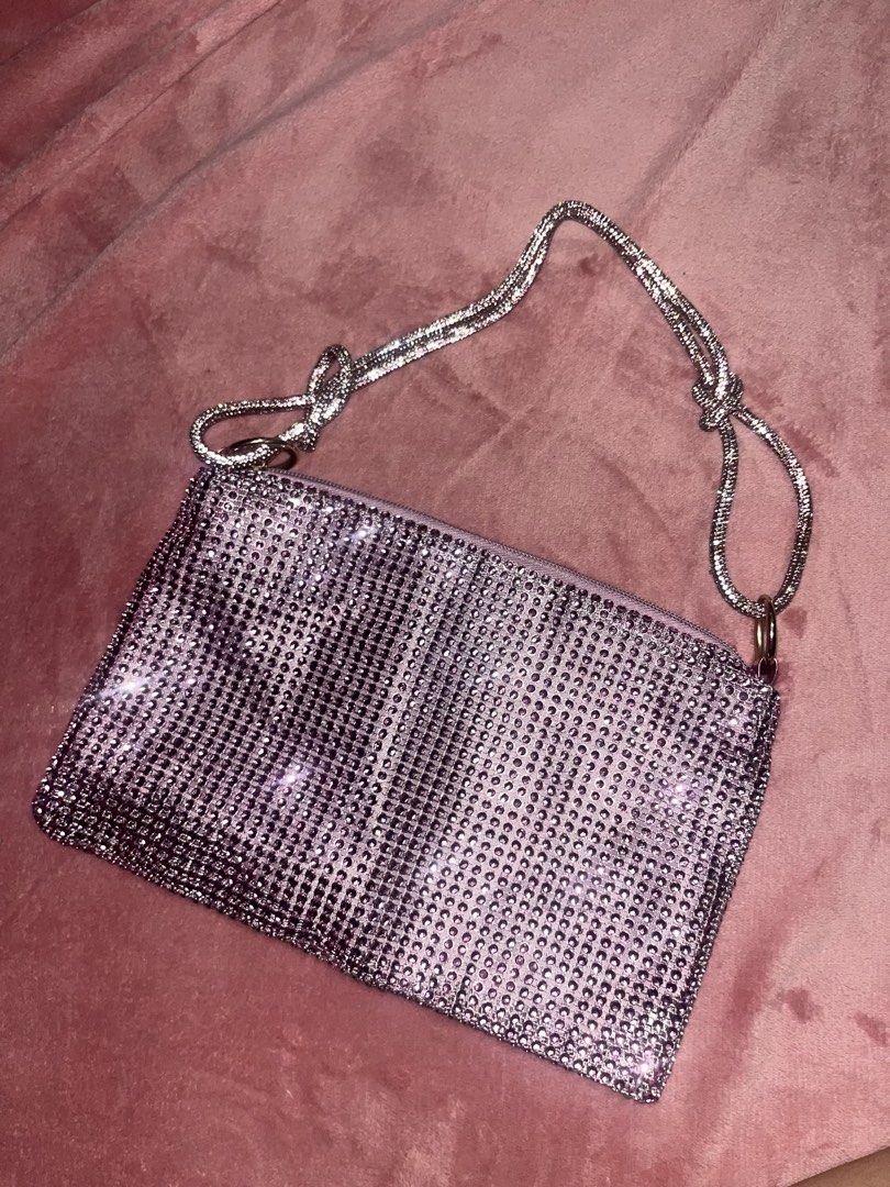 Sparkly Rhinestone Clutch Bag with Silver Chain Strap (Category: Clutches) located in Pasay City. Submitted by losient (Listing ID 1451163133, Image 1). Description: - Super cute sparkly clutch bag covered in rhinestones. - Detachable/tieable silver chain strap included. - Secure zipper closure. - Soft lilac fabric lining inside. - Ideal for nights out, parties, and special occasions. - Fits essentials: phone, keys, and cards..