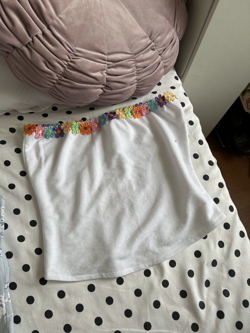 Summer Floral Tube Top and Halter Bundle Set (Category: Sets or Coordinates) located in Pasig City. Submitted by declutterwithme_agb (Listing ID 1451215510, Image 2). Description: - Bundle includes 3 tops and 1 skirt. - Light blue floral halter top. - White tube top with colorful flower trim. - Black tube skirt with embroidered flowers. - Blue and white floral print top. - Ideal for creating versatile summer outfits..