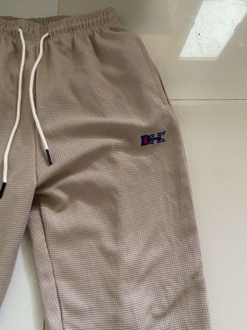 ⭐️Tan Track Pants with Side Stripe (Category: Other Bottoms) located in Bangui. Submitted by loricam (Listing ID 1451246097, Image 2). Description: - Tan colored track pants - Waffle knit texture for comfort - White drawstring at the waist - Side stripe detail (white, black, blue) - Small embroidered logo on left thigh - Perfect for casual wear Free Shipping for 1k plus worth of orders .