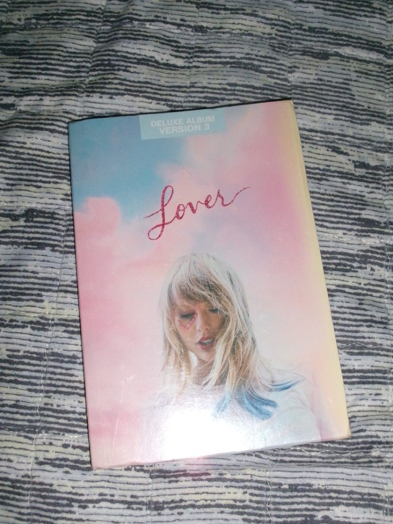 Taylor Swift Lover Deluxe Album Version 3 (Category: CDs & DVDs) located in Taguig. Submitted by dsrmrf (Listing ID 1451257522, Image 1). Description: Taylor Swift Lover Album Deluxe Edition, Version 3. Authentic. Some notes lang: - May plastic cover akong nilagay years ago para hindi madumihan yung cover lol - Cd playes several times but no issues Rfs: Decluttering Location: Taguig.