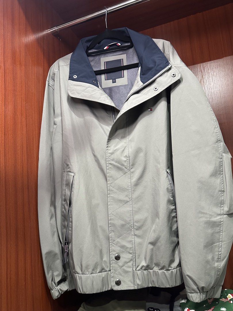 Tommy Hilfiger Men's Light Grey Jacket XL (Category: Coats, Jackets and Outerwear) located in Calamba. Submitted by treb_c (Listing ID 1451132548, Image 1). Description: - Tommy Hilfiger Jacket - Color: Light Grey - Accents: Navy Blue Collar and Trim - Closure: Zipper with Snap Buttons - Pockets: Two Front Pockets with Zippers - Size: XL - Style: Great for casual wear or layering or for motorcycle ride Area Calamba Laguna.