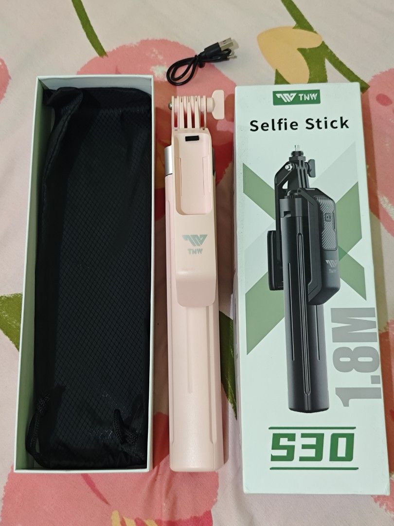 Tripod / Selfie Stand (Category: Mounts & Holders) located in Las Pinas. Submitted by slay_replay (Listing ID 1451227205, Image 1). Description: - TNW S30 Selfie Stand/Tripod color Pink - Never been used (bought a new one) - Issue: No remote attached - Orig Price: Php680.
