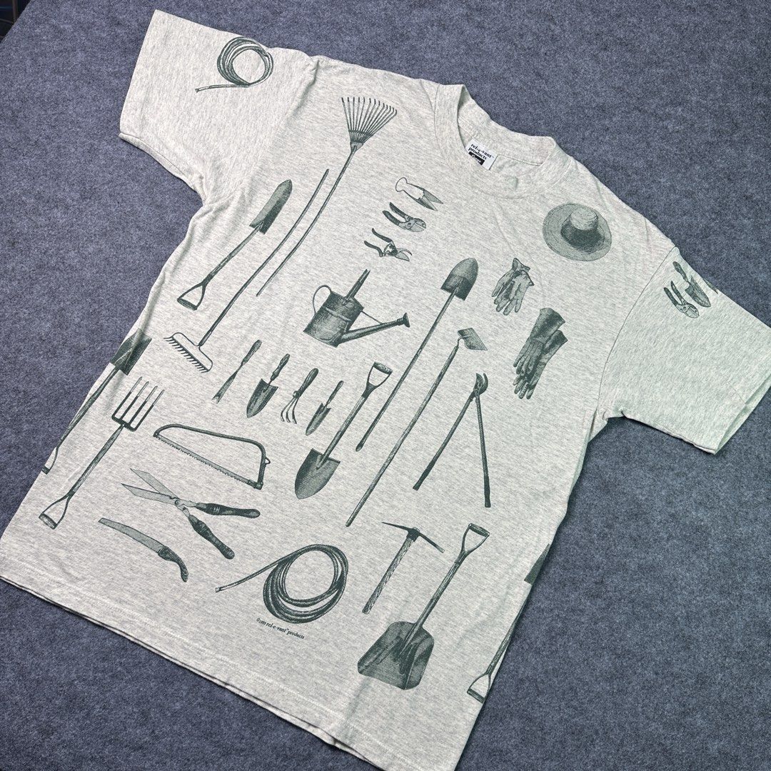 Vintage 90s Art AOP gardening tools relevant tee (Category: Tshirts & Polo Shirts) located in Kajang. Submitted by everfound (Listing ID 1451143558, Image 1). Description: - Vintage art AOP relevant tee - condition good, refer photo (personal item) - tag relevant, Made In USA - Single⬆️⬇️double - Size L on tag, manual refer photo - Price listed Dfod - Post+10/ss+15 - No cod - No return & refund 🗄️B4,0384.