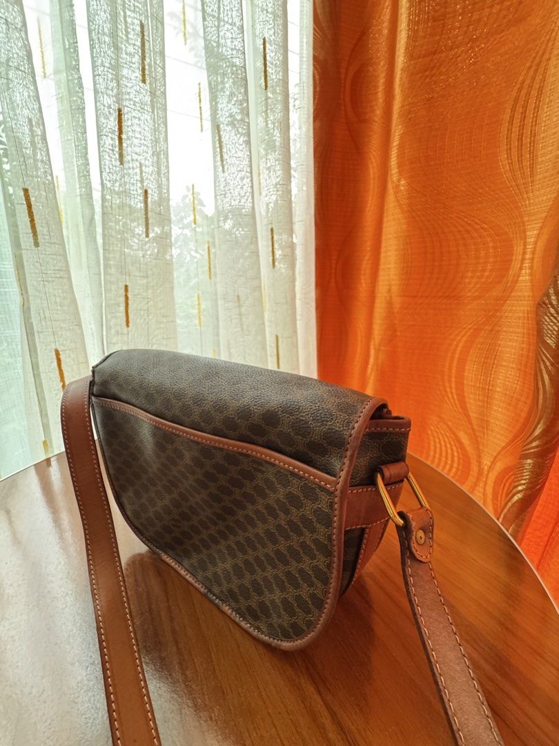 Vintage Celine Macadam Shoulder Bag (Category: Luxury Bags & Wallets) located in Manila. Submitted by raewiee7 (Listing ID 1451284660, Image 3). Description: - Iconic Celine Macadam print shoulder bag - Classic brown and tan colorway - Genuine leather trim and strap - Features an interior zip pocket - Comes with original dust bag - A timeless and versatile accessory.