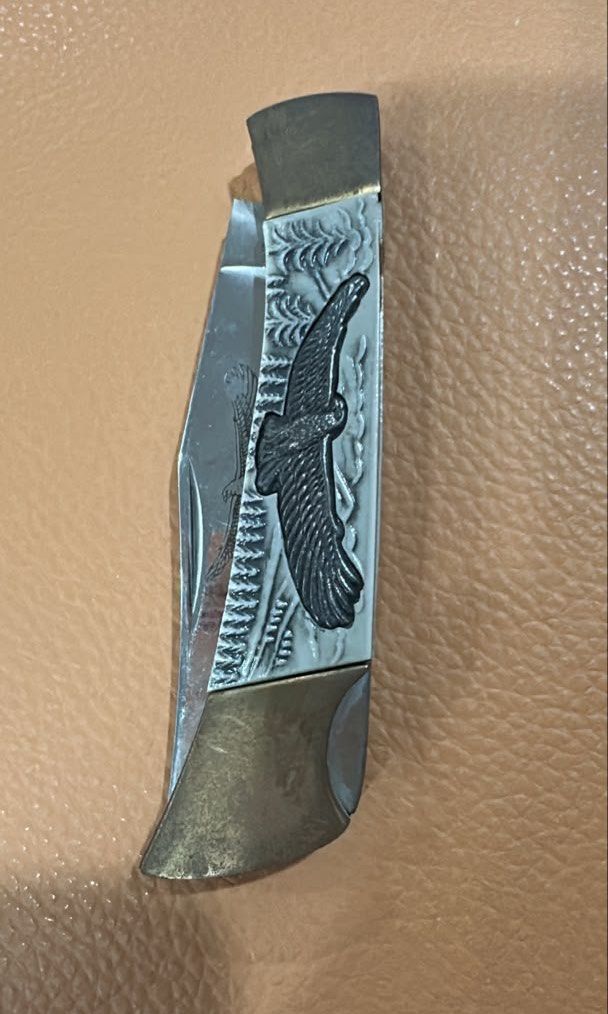Vintage Eagle Folding Pocket Knife (Category: Vintage Collectibles) located in Kuala Lumpur. Submitted by nojoybidderpls (Listing ID 1449231966, Image 1). Description: - Cool vintage pocket knife - Features an eagle design on the handle - Blade opens and closes smoothly - Brass accents - Great for collectors or everyday carry (EDC) - Small pink sticker on the handle.