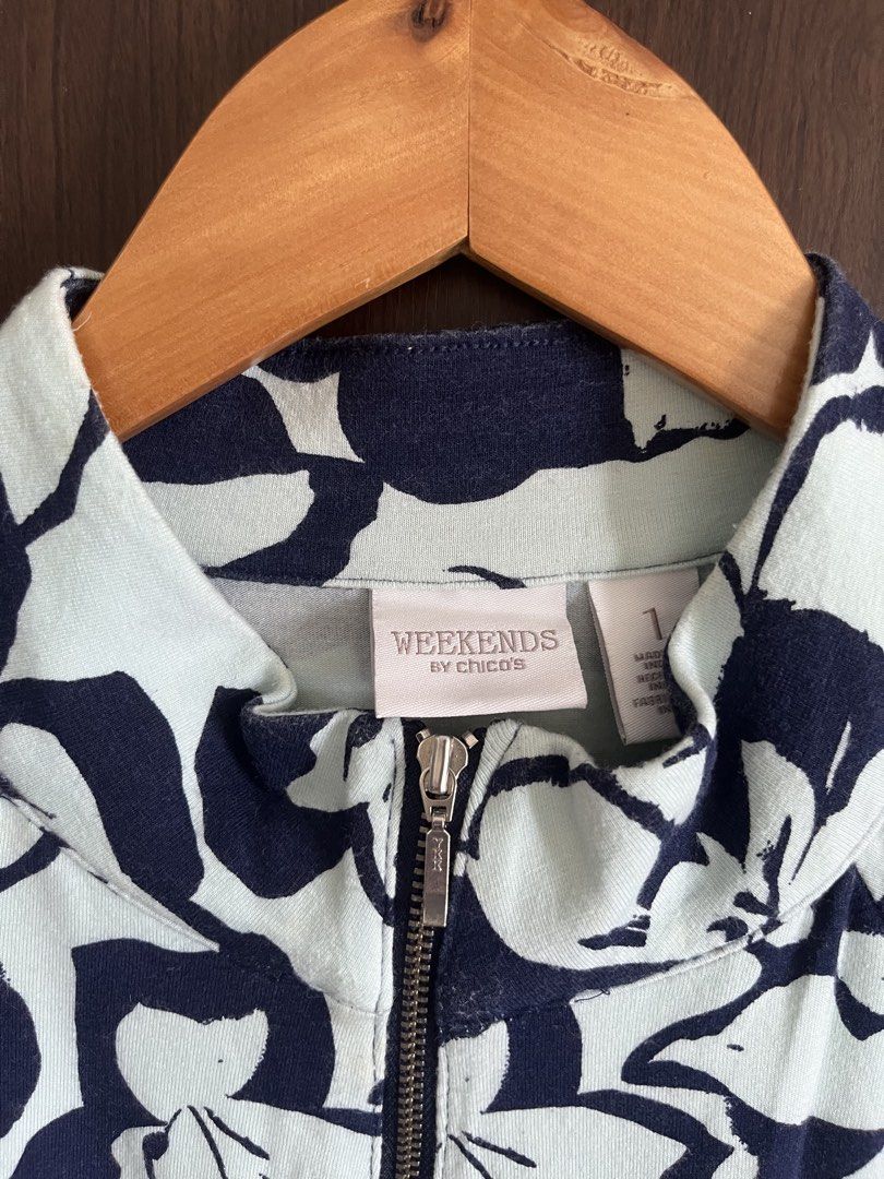 Weekends by Chico's Floral Zip-Up Jacket Size 1 (Category: Coats, Jackets and Outerwear) located in Manila. Submitted by mentone (Listing ID 1451135005, Image 2). Description: - Light blue jacket - Navy blue floral print - Zip-up front - Three-quarter sleeves - Ideal for layering - Comfortable and stylish - Brand: Weekends by Chico's.
