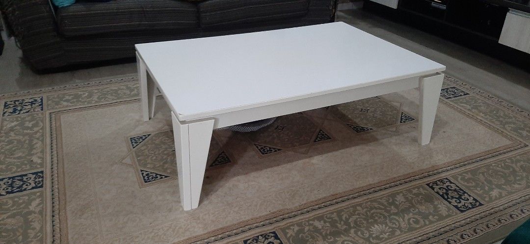 White Rectangular Coffee Table (Category: Tables & Sets) located in Nilai. Submitted by quickphoenix_d29298 (Listing ID 1451315673, Image 1). Description: - Sleek white rectangular coffee table - Modern and simple design - Unique angled legs - Ideal for living room spaces - Dimensions: Approx. 120cm(L)×80cm(W)×40cm(H) - Self Pick up: Nilai/ Selayang or - by lalamove .