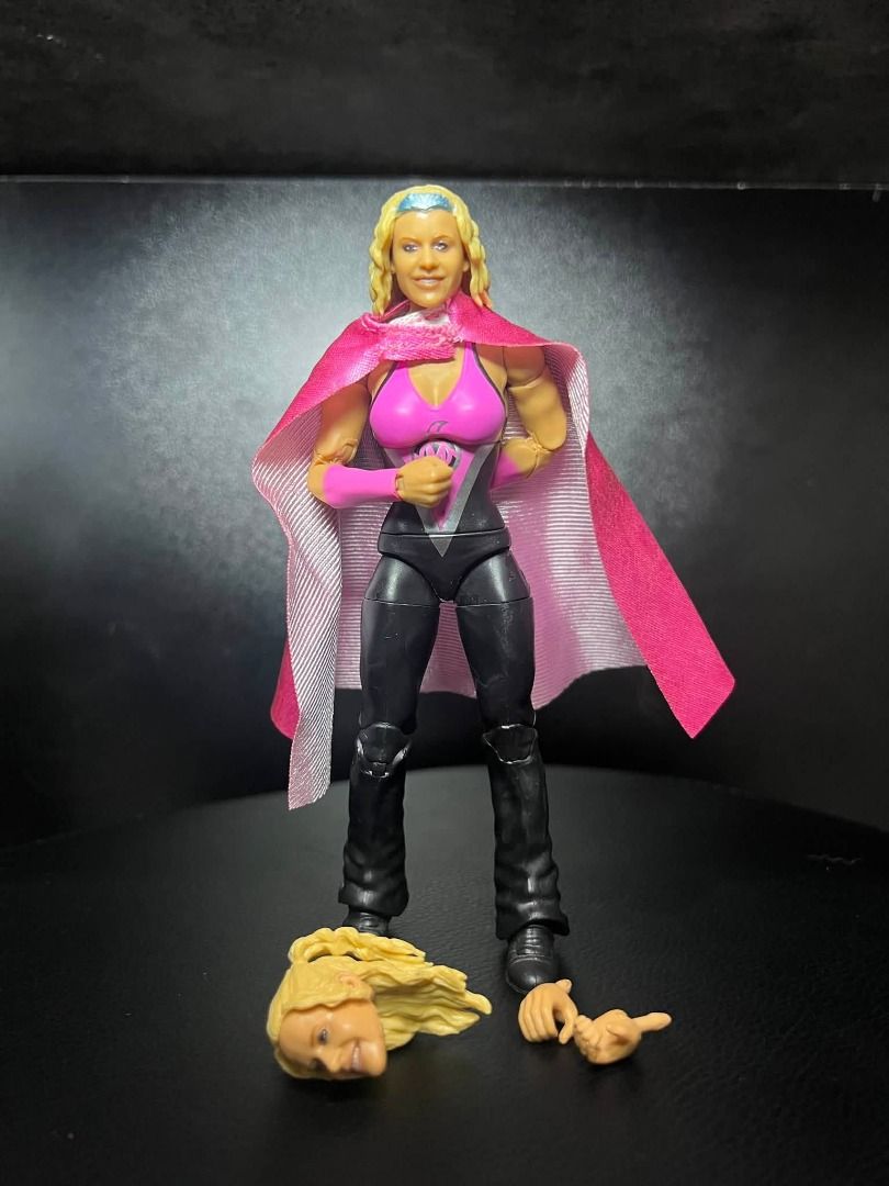 WWE Mattel Elite Molly Holly (Category: Figurines & Statues) located in San Fernando. Submitted by winterors (Listing ID 1451260299, Image 1). Description: - Molly Holly action figure - Includes interchangeable hands - Comes with an alternate head - Features signature pink and black outfit with a pink cape - Ideal for wrestling fan collections - Perfect for posing and display.