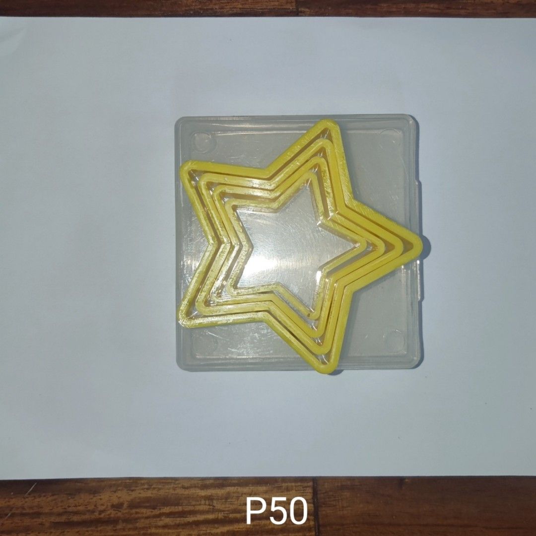 Yellow Star Cookie Cutters Set with Case (Category: Bakeware) located in Muntinlupa City. Submitted by angeline_cga (Listing ID 1451149710, Image 1). Description: - Set of yellow star-shaped cookie cutters. - Comes with a clear plastic case for easy storage. - Includes multiple sizes for various cookie designs. - Ideal for baking and decorating projects..