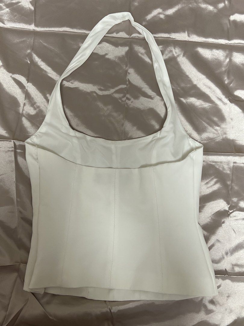 Zara White Halter Top (Category: Sleeveless) located in Quezon City. Submitted by declutterwithrei (Listing ID 1451288464, Image 2). Description: Zara white halter neck corset top, size XS. Versatile for summer, parties, or casual wear. Best fits 32-34A bust and 23-25 waist. ❗️Also for sale in Black, same size.