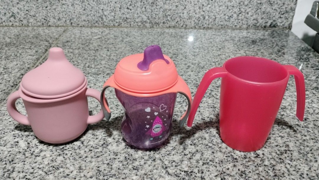 Take All 3pcs Tommee Tippee & Assorted Baby Sippy Cups (Category: Weaning & Toddler Feeding) located in Imus. Submitted by viaysthriftshop (Listing ID 1451411646, Image 1). Description: Take All 3pcs Baby Sippy Cups - ▪️Tommee Tippee Purple - soft spout, EUC ▪️Red cup - made in Germany, thick material, Like New ▪️Pink - no brand, silicone, Like New ▪️From UK 🇬🇧 Thrift Box 𝗠𝗢𝗣 ▪️GCASH ▪️Sh0pee COD/SPaylater @ ₱295 (or any Sh0pee payment metho