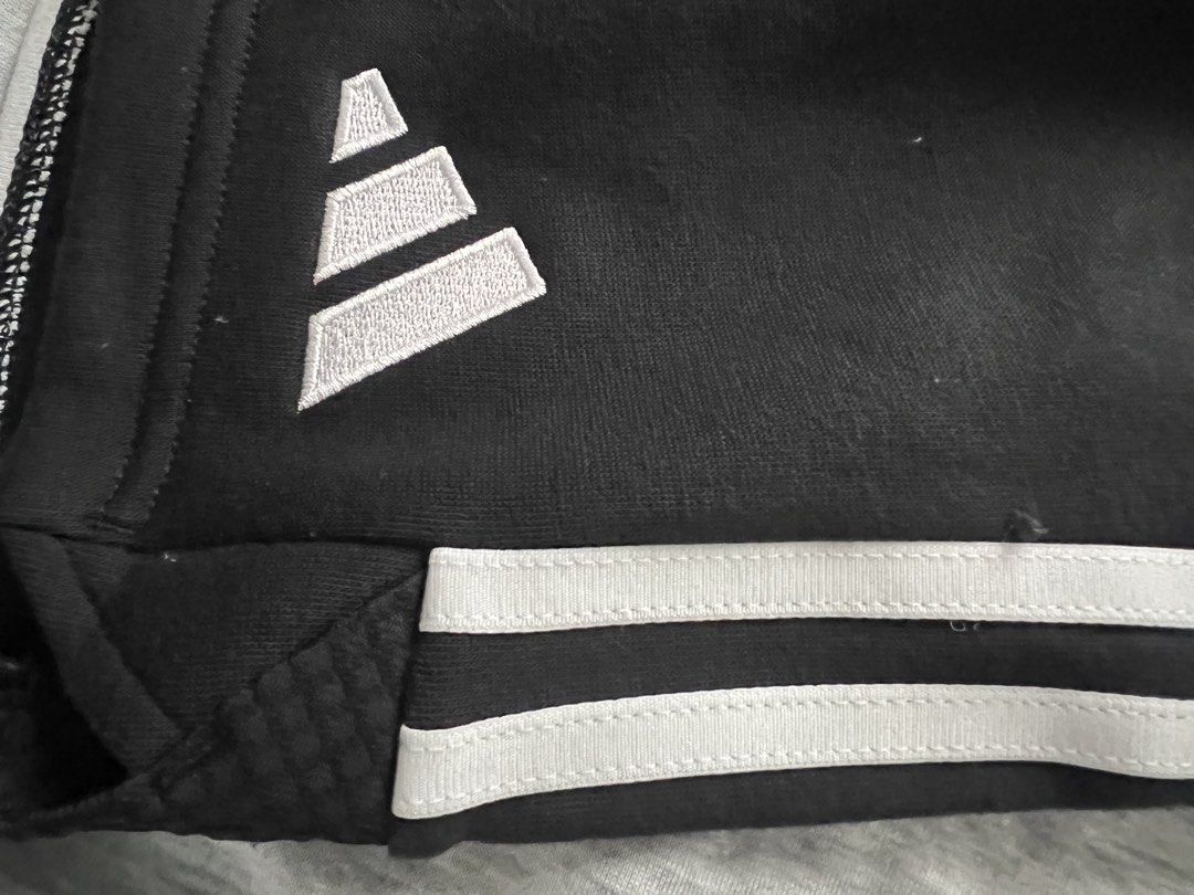 Adidas Black Shorts with White Stripes (Category: Shorts) located in Muntinlupa City. Submitted by 09leah77 (Listing ID 1451326281, Image 2). Description: - Brand new Adidas shorts with tags attached - Classic three white stripes down the sides - Embroidered Adidas logo on the left leg - Elastic waistband with drawstring for a comfortable fit - Versatile for sports activities or casual everyday wear.