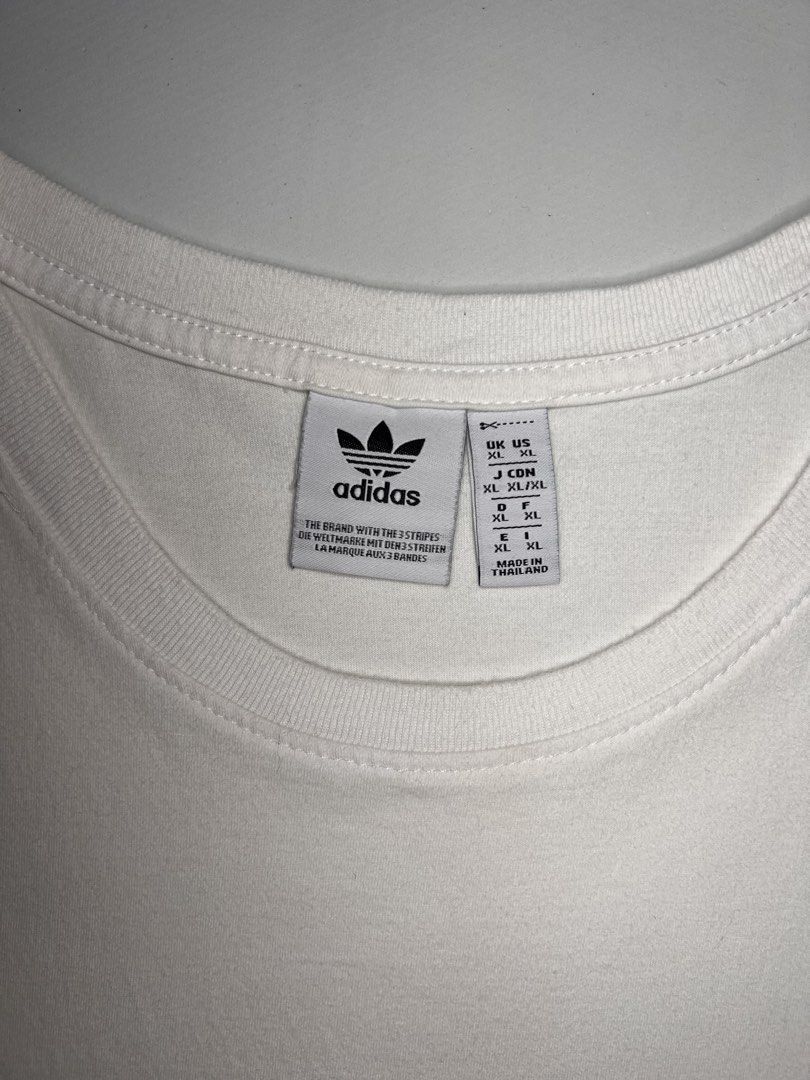 Adidas Essentials Small Logo Single Jersey Tank Top (White) (Category: Activewear) located in Manila. Submitted by randsclothingstore (Listing ID 1451327997, Image 3). Description: BRAND: Adidas Size (Inch) ‼️Medida Size‼️ : W 21 | L 28 Color Rate: 9/10 Condition: Like New Issue: Loose stitching on neck line, fine lints, not so white and needs bleaching ‼️ Thrifted item — please manage your expectations, authenticity is not guaranteed (check phot