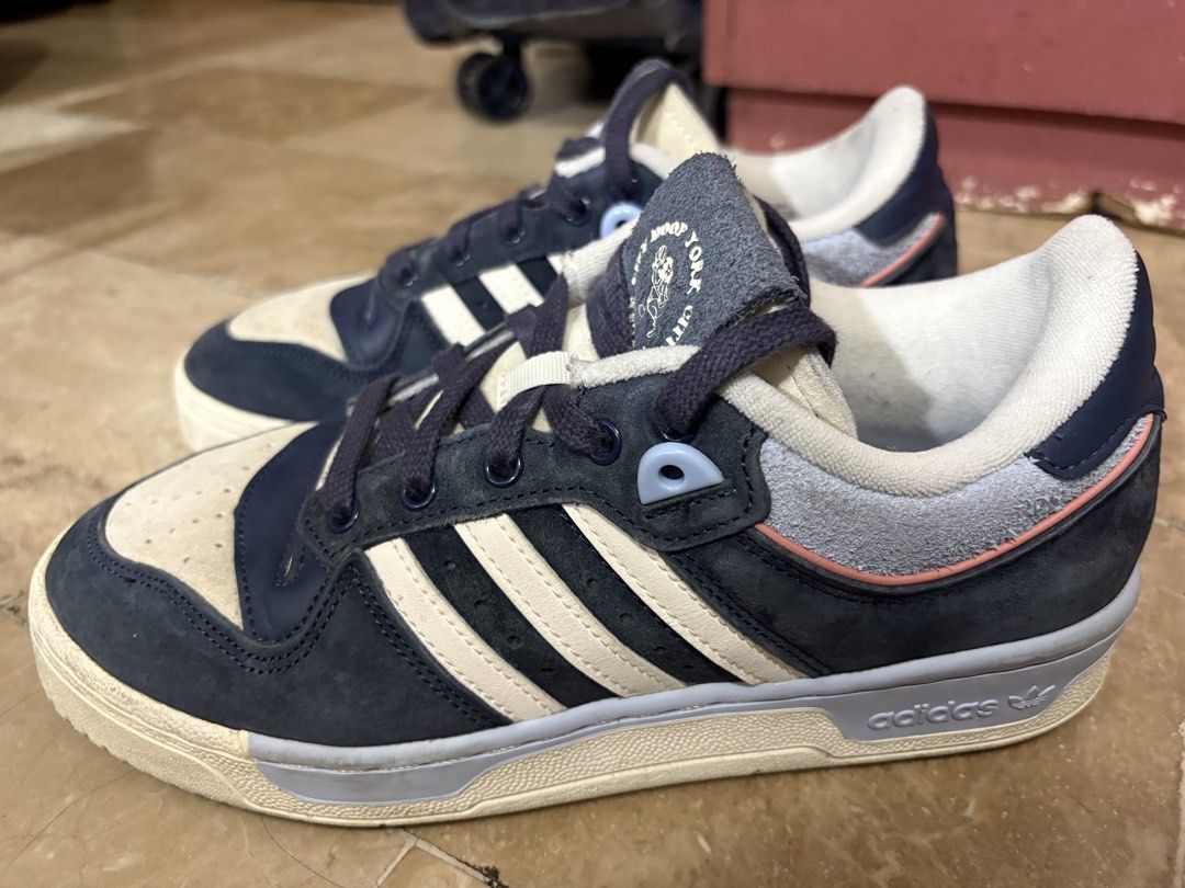 Adidas Rivalry Low (Category: Sneakers) located in Pasig City. Submitted by maria.ariam (Listing ID 1451433137, Image 3). Description: - Adidas Rivalry Low sneakers - Colorway: Navy and Cream - Features classic three stripes - Size: US 7.5 / UK 6 / EU 39 .