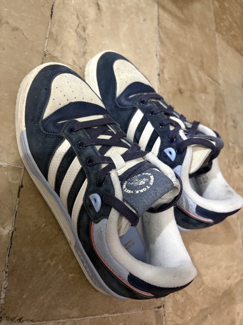 Adidas Rivalry Low (Category: Sneakers) located in Pasig City. Submitted by maria.ariam (Listing ID 1451433137, Image 2). Description: - Adidas Rivalry Low sneakers - Colorway: Navy and Cream - Features classic three stripes - Size: US 7.5 / UK 6 / EU 39 .
