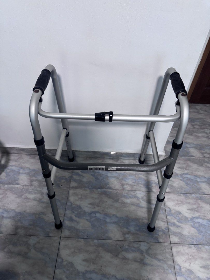 Adjustable Folding Walker (Category: Rehabilitative Devices) located in Singapore. Submitted by 88maggie (Listing ID 1451363593, Image 1). Description: - Lightweight aluminum frame - Folds for easy storage and transport - Adjustable height legs - Comfortable grip handles - Ideal mobility assistance.