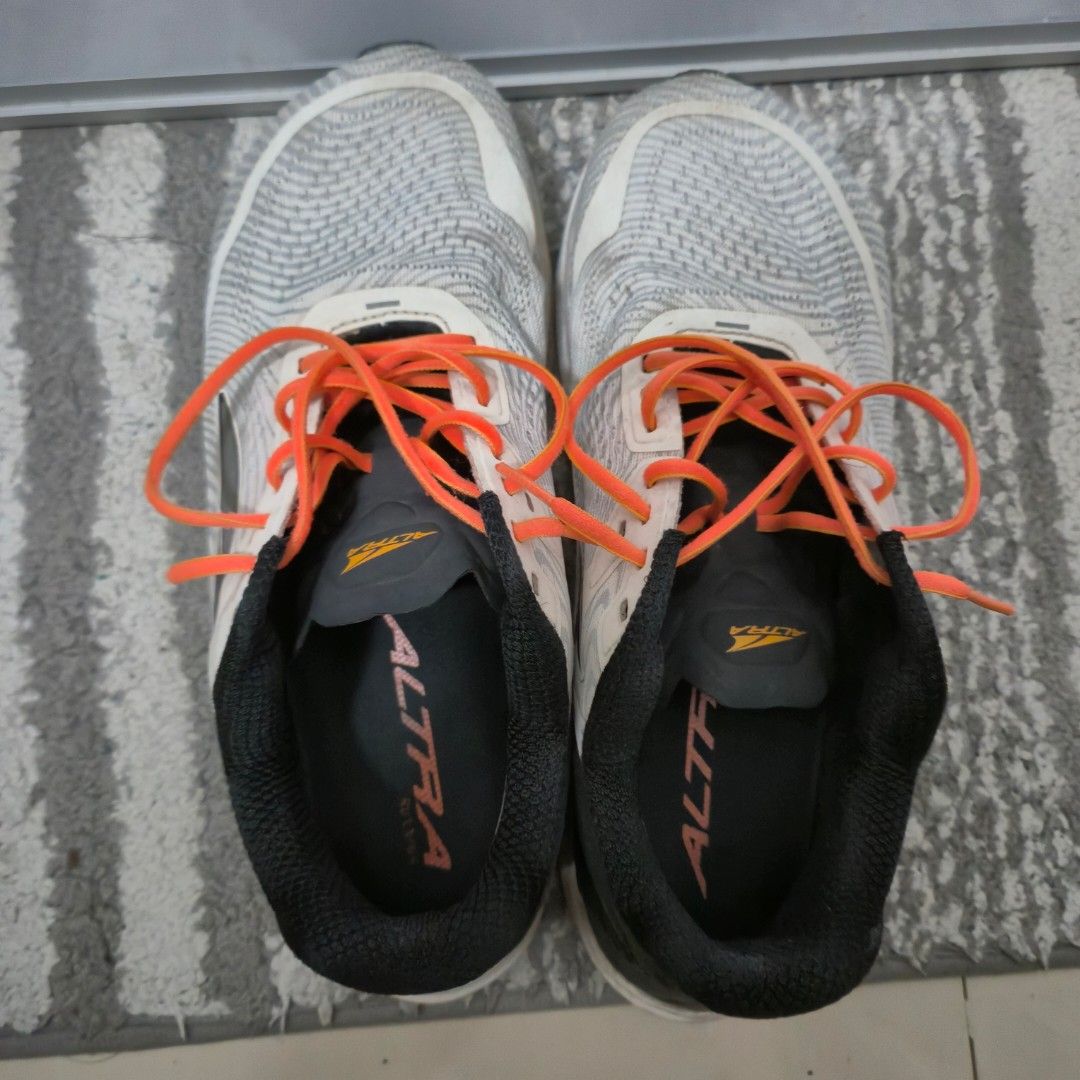 Altra Torin 5 White Orange (Category: Casual Shoes) located in Cavite. Submitted by junrayy (Listing ID 1451445197, Image 2). Description: Size 9.5US Excellent condition No issue Nego pa basta sure buyer madali ako kausap wag lang buraot. Ship lalamove/lbc at buyer's expense.