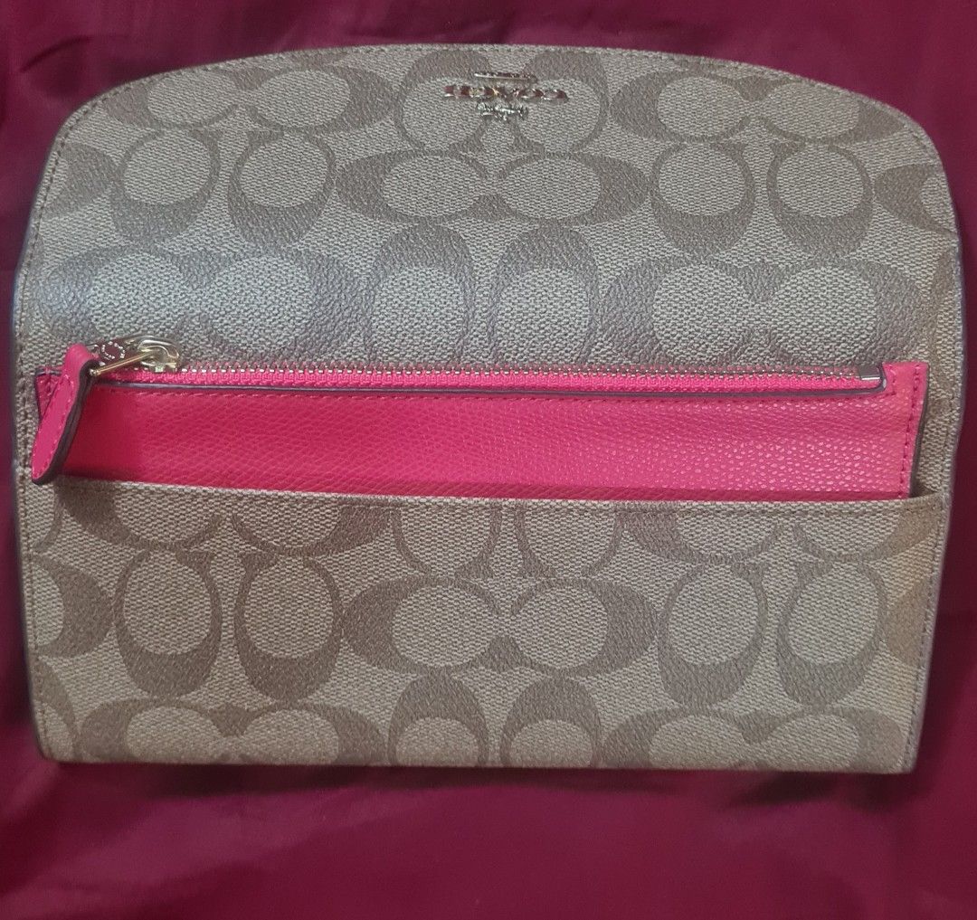 AUTHENTIC Coach Signature C Monogram Long Wallet (Category: Luxury Bags & Wallets) located in Paranaque City. Submitted by lorem45 (Listing ID 1451327105, Image 3). Description: NEVER BEEN USED! - Authentic Coach long wallet - Signature C monogram canvas exterior - Bright pink leather interior - Multiple card slots for organization - Zippered pocket for coins - Secure snap closure.