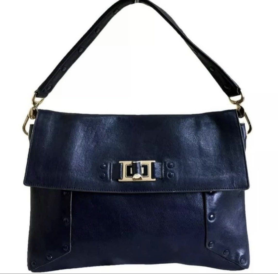 RUSH SALE Authentic Preloved Anya Hindmarch Navy Studded Leather Envelope Bag (Category: Luxury Bags & Wallets) located in Baguio. Submitted by designerbin.ph (Listing ID 1451336105, Image 1). Description: Authentic Preloved Anya Hindmarch Navy Studded Leather Envelope Bag Made in Italy Condition: Navy studded leather envelope shoulder bag by Anya Hindmarch. Features single compartment with interior slip pocket, leather lining, gold tone hardware