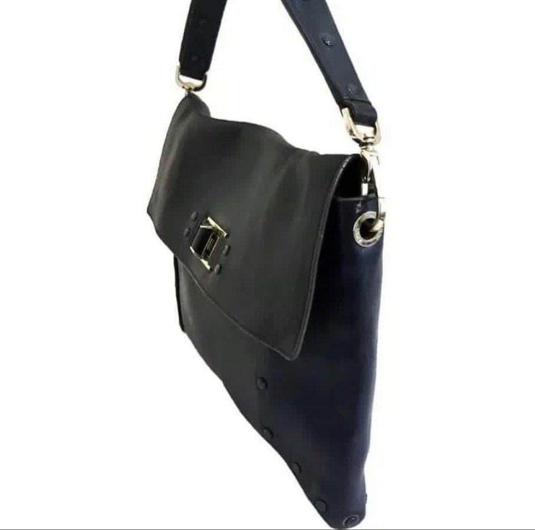 RUSH SALE Authentic Preloved Anya Hindmarch Navy Studded Leather Envelope Bag (Category: Luxury Bags & Wallets) located in Baguio. Submitted by designerbin.ph (Listing ID 1451336105, Image 3). Description: Authentic Preloved Anya Hindmarch Navy Studded Leather Envelope Bag Made in Italy Condition: Navy studded leather envelope shoulder bag by Anya Hindmarch. Features single compartment with interior slip pocket, leather lining, gold tone hardware