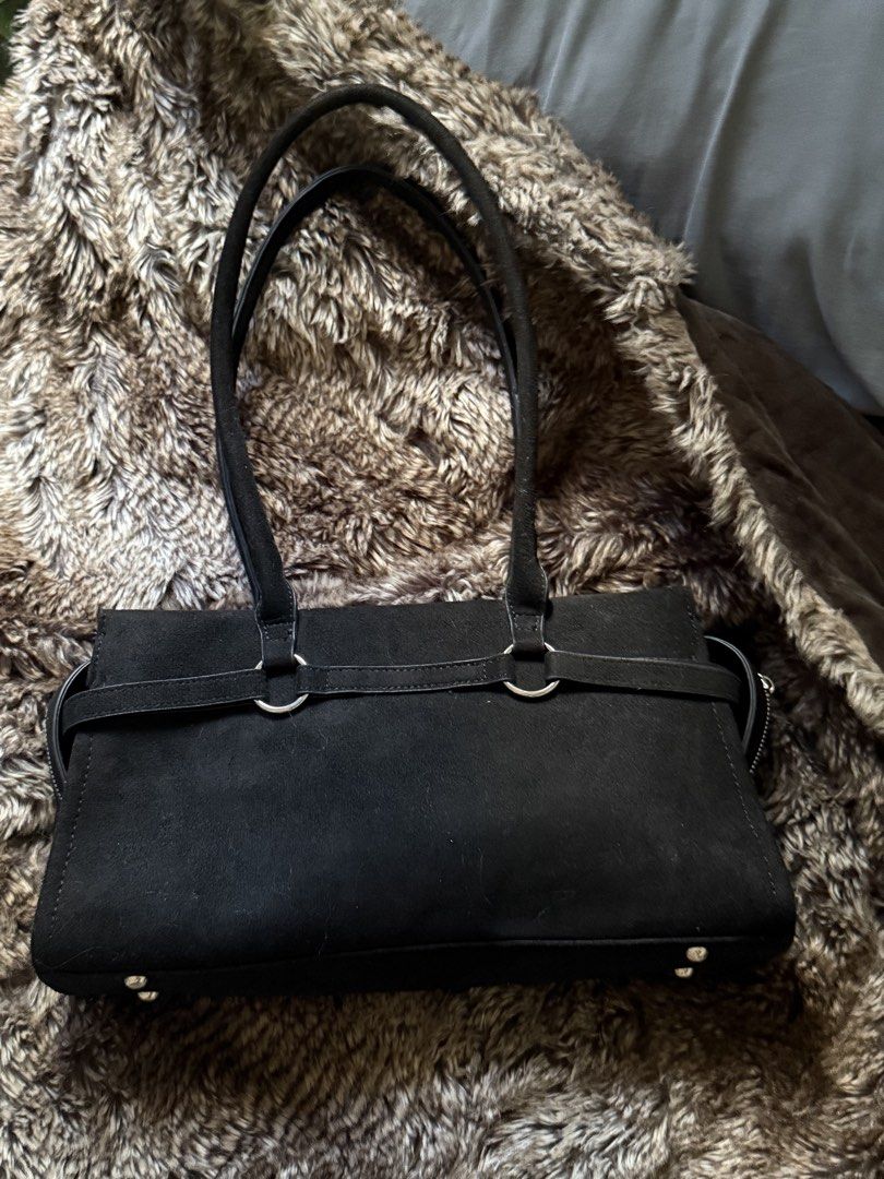 Black shoulder bag (Category: Shoulder Bags) located in San Fernando. Submitted by _ingeolmi (Listing ID 1451344524, Image 2). Description: Black faux suede shoulder bag with silver-tone hardware and an adjustable buckle accent. Minimalist, timeless, and roomy enough for your everyday essentials..