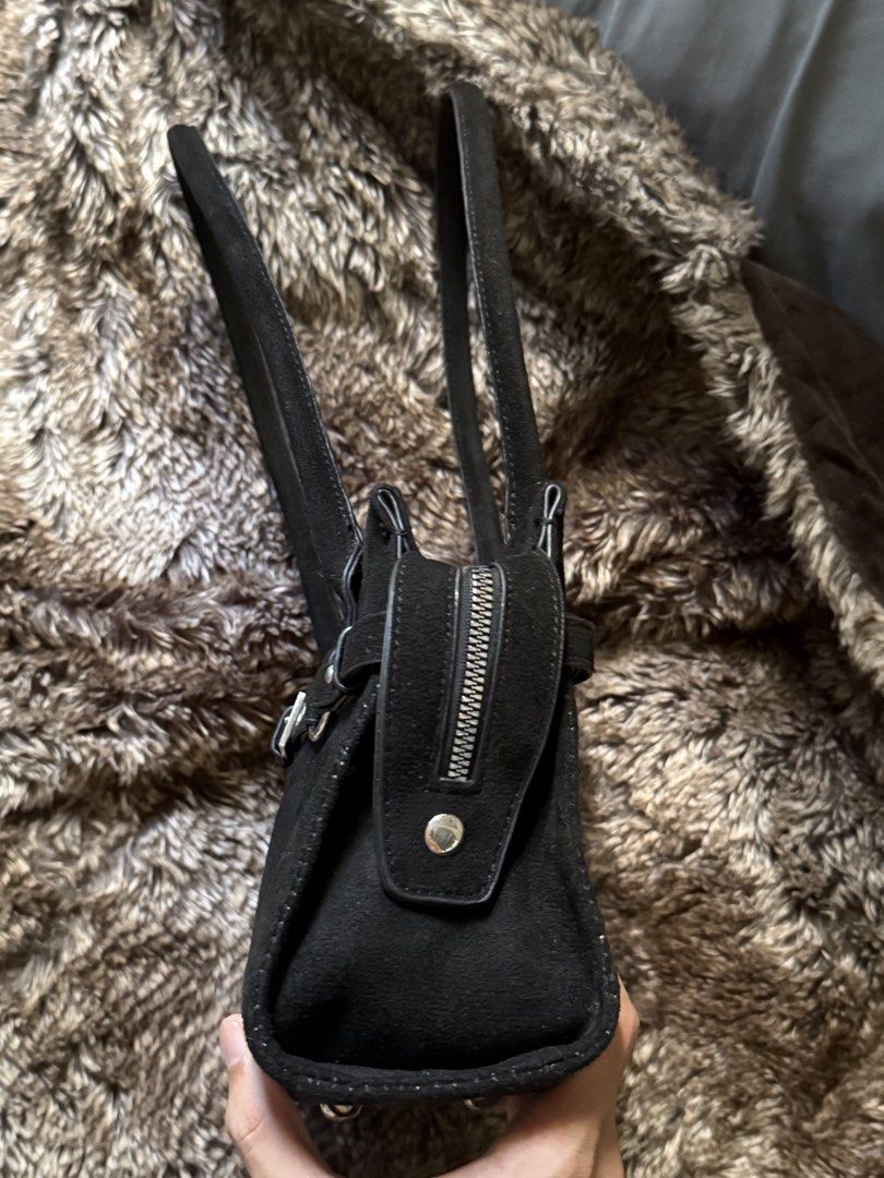 Black shoulder bag (Category: Shoulder Bags) located in San Fernando. Submitted by _ingeolmi (Listing ID 1451344524, Image 3). Description: Black faux suede shoulder bag with silver-tone hardware and an adjustable buckle accent. Minimalist, timeless, and roomy enough for your everyday essentials..