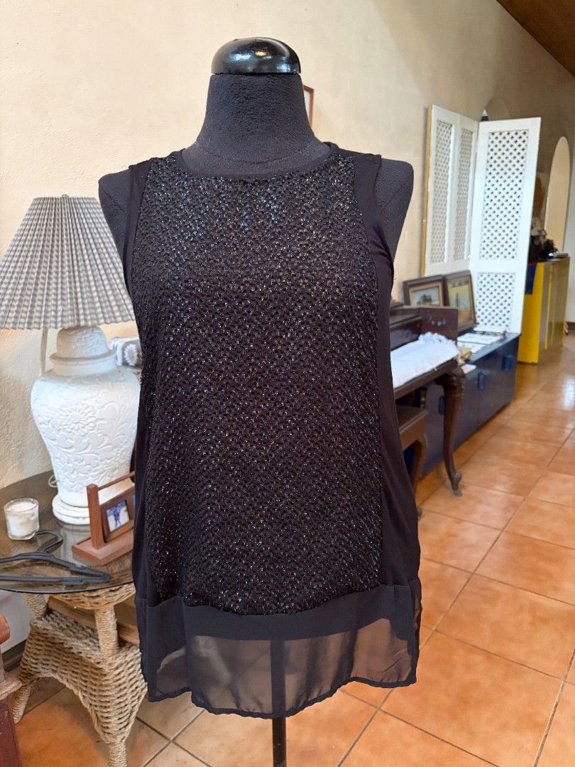 Black Sparkly Mesh Top Sheer Sleeves (Category: Blouses) located in Makati City. Submitted by micmic804 (Listing ID 1451325977, Image 1). Description: - Chic black top with a unique sparkly textured front panel. - Features sheer fabric on the sleeves and sides for a stylish look. - Highly versatile, suitable for both casual and dressy occasions. - Ideal for parties, nights out, or adding a touch of glamour to your outfit. - Bought but never worn.