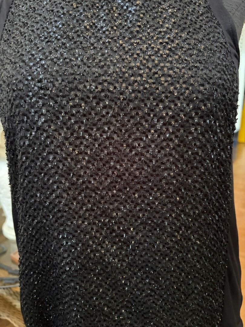 Black Sparkly Mesh Top Sheer Sleeves (Category: Blouses) located in Makati City. Submitted by micmic804 (Listing ID 1451325977, Image 3). Description: - Chic black top with a unique sparkly textured front panel. - Features sheer fabric on the sleeves and sides for a stylish look. - Highly versatile, suitable for both casual and dressy occasions. - Ideal for parties, nights out, or adding a touch of glamour to your outfit. - Bought but never worn.